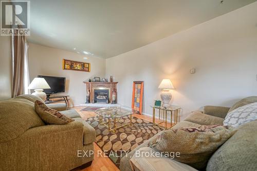 41 Queen Street, Strathroy-Caradoc (Caradoc), ON - Indoor Photo Showing Living Room With Fireplace