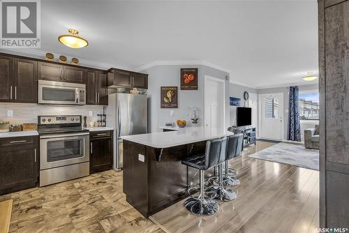 261 250 Akhtar Bend, Saskatoon, SK - Indoor Photo Showing Kitchen With Stainless Steel Kitchen With Upgraded Kitchen