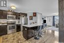 261 250 Akhtar Bend, Saskatoon, SK  - Indoor Photo Showing Kitchen With Stainless Steel Kitchen With Upgraded Kitchen 