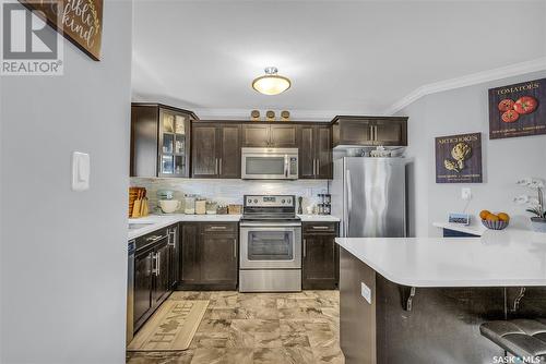 261 250 Akhtar Bend, Saskatoon, SK - Indoor Photo Showing Kitchen With Stainless Steel Kitchen