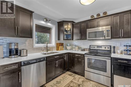 261 250 Akhtar Bend, Saskatoon, SK - Indoor Photo Showing Kitchen With Stainless Steel Kitchen With Double Sink