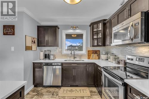 261 250 Akhtar Bend, Saskatoon, SK - Indoor Photo Showing Kitchen With Stainless Steel Kitchen With Double Sink