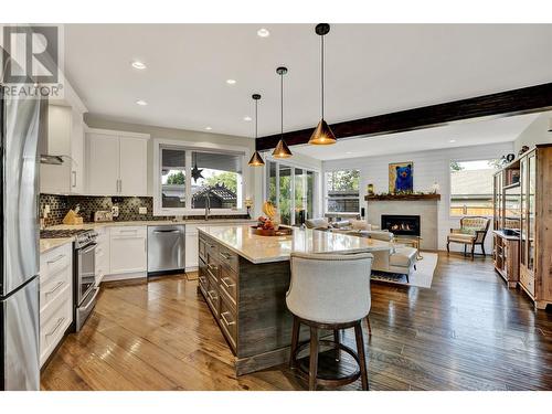 1195 Koby Court, Kelowna, BC - Indoor Photo Showing Kitchen With Fireplace With Upgraded Kitchen