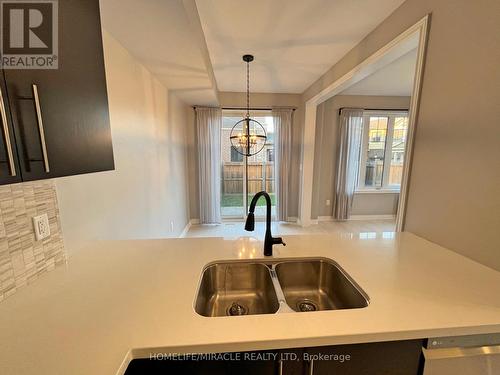 166 - 1890 Rymal Road E, Hamilton, ON - Indoor Photo Showing Kitchen With Double Sink