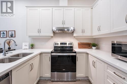 109 - 30 Hamilton Street S, Hamilton, ON - Indoor Photo Showing Kitchen With Stainless Steel Kitchen With Double Sink