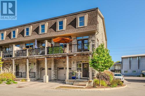 90 Cardigan Street, Guelph, ON - Outdoor With Balcony With Facade