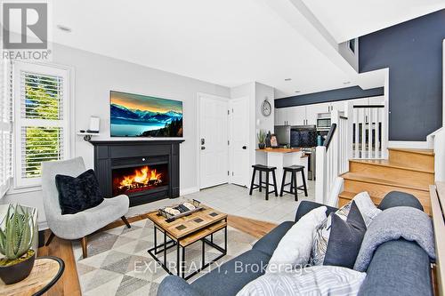 510 - 796468 19 Grey Road, Blue Mountains, ON - Indoor Photo Showing Living Room With Fireplace