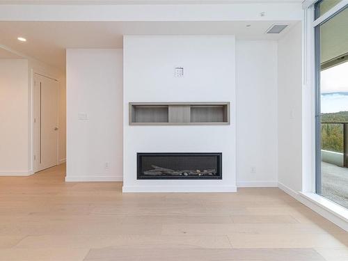 704-2000 Hannington Rd, Langford, BC - Indoor Photo Showing Living Room With Fireplace