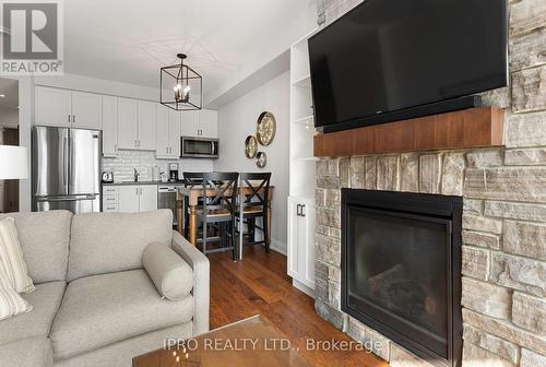 16 - 1869 Highway 118 West, Bracebridge, ON - Indoor Photo Showing Living Room With Fireplace