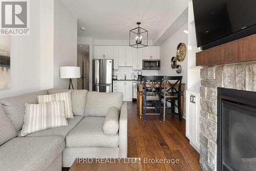 16 - 1869 Highway 118 West, Bracebridge, ON - Indoor Photo Showing Living Room With Fireplace