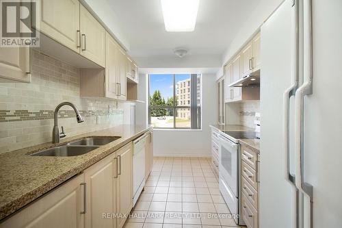 203 - 2100 John Street, Markham, ON - Indoor Photo Showing Kitchen With Double Sink