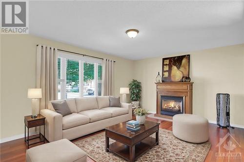 Photo is virtually staged - 94 Drummond Street E, Perth, ON - Indoor Photo Showing Living Room With Fireplace