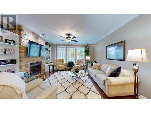 100 1702 Dyke Road, Quesnel, BC - Indoor Photo Showing Living Room With Fireplace