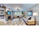 100 1702 Dyke Road, Quesnel, BC  - Indoor Photo Showing Living Room With Fireplace 