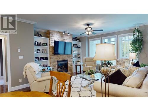 100 1702 Dyke Road, Quesnel, BC - Indoor Photo Showing Living Room With Fireplace