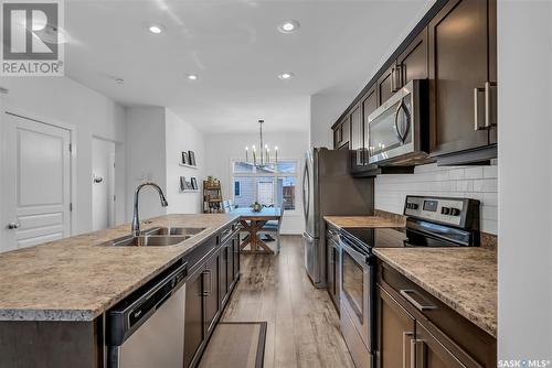 325 Secord Way, Saskatoon, SK - Indoor Photo Showing Kitchen With Double Sink With Upgraded Kitchen