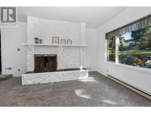 7701 Holtam Drive, Coldstream, BC - Indoor Photo Showing Living Room With Fireplace