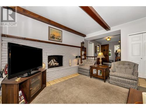 7701 Holtam Drive, Coldstream, BC - Indoor Photo Showing Living Room With Fireplace