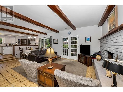 7701 Holtam Drive, Coldstream, BC - Indoor Photo Showing Living Room With Fireplace