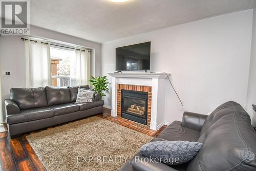 30 Aikens Crescent, Barrie, ON - Indoor Photo Showing Living Room With Fireplace