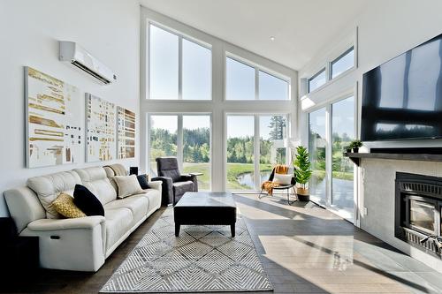 Salon - 80 Ch. Lebel, Saint-Herménégilde, QC - Indoor Photo Showing Living Room With Fireplace