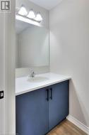 Bathroom with vanity and wood-type flooring - 