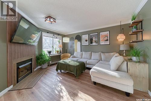 1707 Clive Bay E, Regina, SK - Indoor Photo Showing Living Room With Fireplace