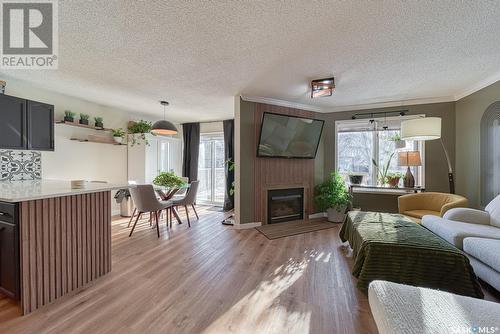 1707 Clive Bay E, Regina, SK - Indoor Photo Showing Living Room With Fireplace