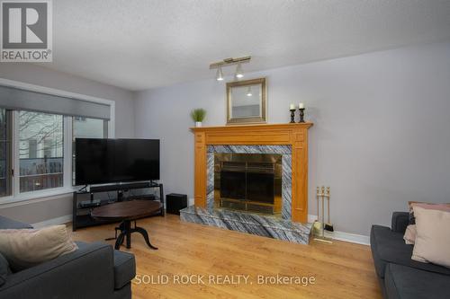 17 Hunterswood Crescent, Ottawa, ON - Indoor Photo Showing Living Room With Fireplace