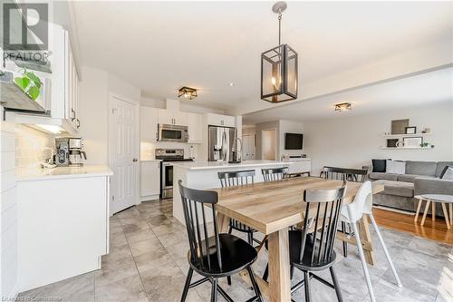 Dining room with light tile patterned floors and sink - 12 Hardcastle Place, Cambridge, ON - Indoor Photo Showing Other Room