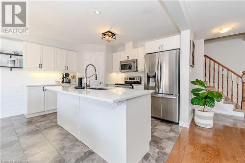 Kitchen featuring white cabinetry, appliances with stainless steel finishes, a kitchen island with sink, and sink - 12 Hardcastle Place, Cambridge, ON - Indoor Photo Showing Kitchen With Stainless Steel Kitchen With Upgraded Kitchen