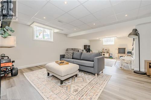 Living room with a paneled ceiling and light hardwood / wood-style flooring - 12 Hardcastle Place, Cambridge, ON - Indoor