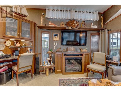 Electric fireplace, built in desk - 8000 Highland Road Unit# 42, Vernon, BC - Indoor