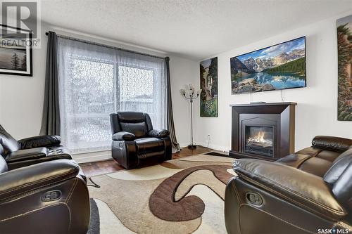 1210 Butterfield Crescent, Regina, SK - Indoor Photo Showing Living Room With Fireplace