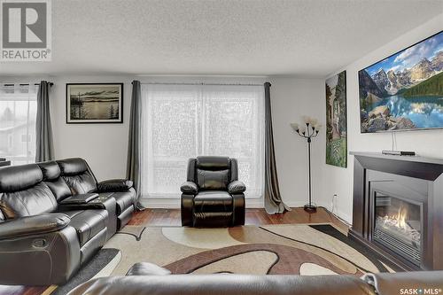 1210 Butterfield Crescent, Regina, SK - Indoor Photo Showing Living Room With Fireplace