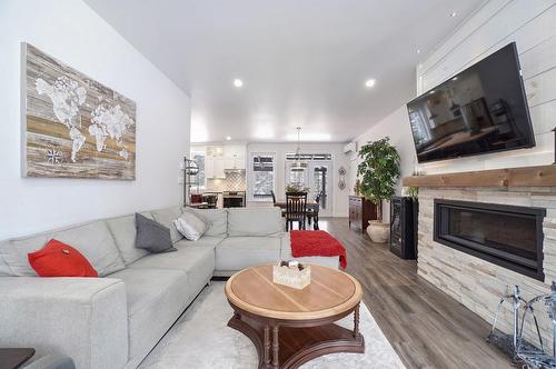 Overall view - 111 Rue Du Joli-Bois, Sainte-Marguerite-Du-Lac-Masson, QC - Indoor Photo Showing Living Room With Fireplace