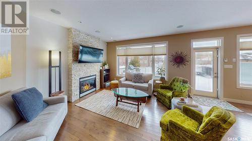 4421 Sandpiper Crescent E, Regina, SK - Indoor Photo Showing Living Room With Fireplace