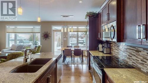 4421 Sandpiper Crescent E, Regina, SK - Indoor Photo Showing Kitchen With Double Sink With Upgraded Kitchen