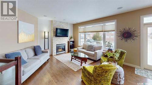 4421 Sandpiper Crescent E, Regina, SK - Indoor Photo Showing Living Room With Fireplace