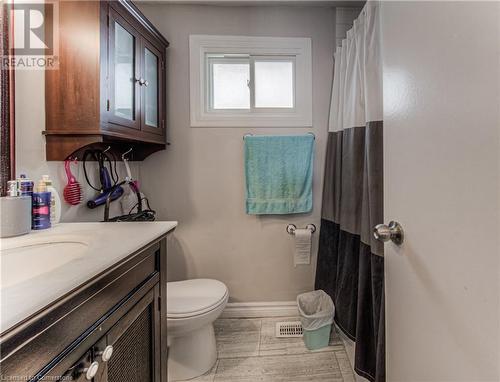 Bathroom with vanity, hardwood / wood-style floors, and toilet - 539 Pinetree Crescent, Cambridge, ON - Indoor Photo Showing Bathroom