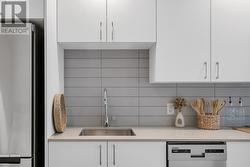 Modern Kitchen features a large-format subway tile backsplash - 