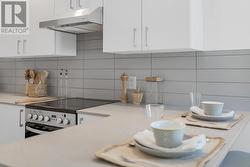 Modern Kitchen features a large-format subway tile backsplash - 