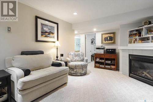 1526 Dewdney Bay, Regina, SK - Indoor Photo Showing Living Room With Fireplace