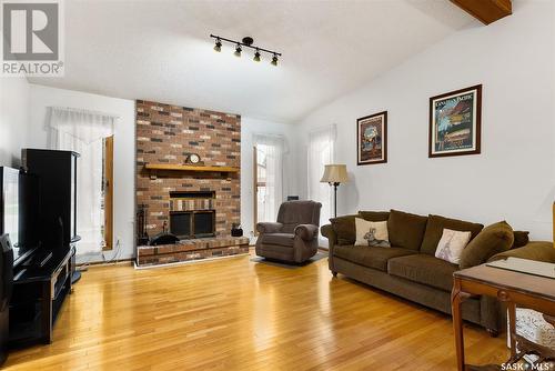 2806 Staples Bay E, Regina, SK - Indoor Photo Showing Living Room With Fireplace