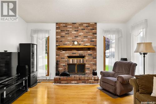 2806 Staples Bay E, Regina, SK - Indoor Photo Showing Living Room With Fireplace