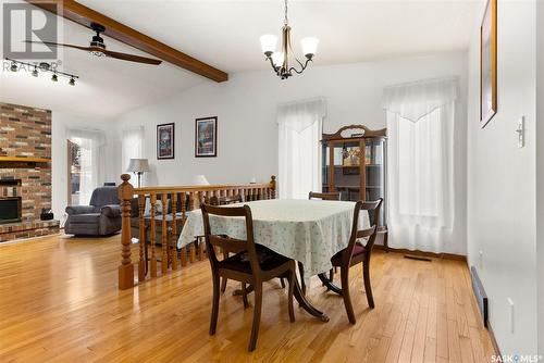 2806 Staples Bay E, Regina, SK - Indoor Photo Showing Dining Room With Fireplace