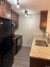 102 1220 Blackfoot Drive, Regina, SK  - Indoor Photo Showing Kitchen With Double Sink 