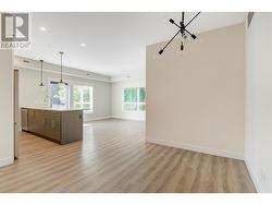 View from Foyer - Dining area on right, Kitchen on left, LR at far enbd - 