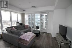 Living room featuring dark hardwood / wood-style floors - 