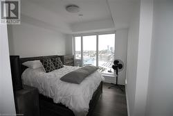 Bedroom with dark wood-type flooring - 